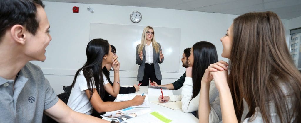 Teacher with Students in the Classroom Interacting