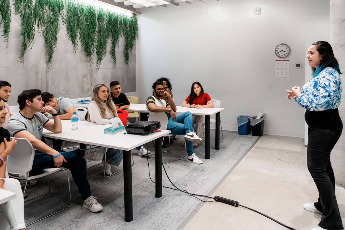 Undergraduate students learning about ILAC’s University Pathway Program in a classroom