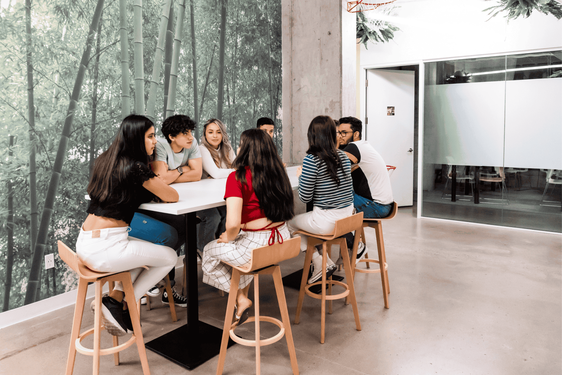 A group of friends spending time together in the common area at ILAC Campus