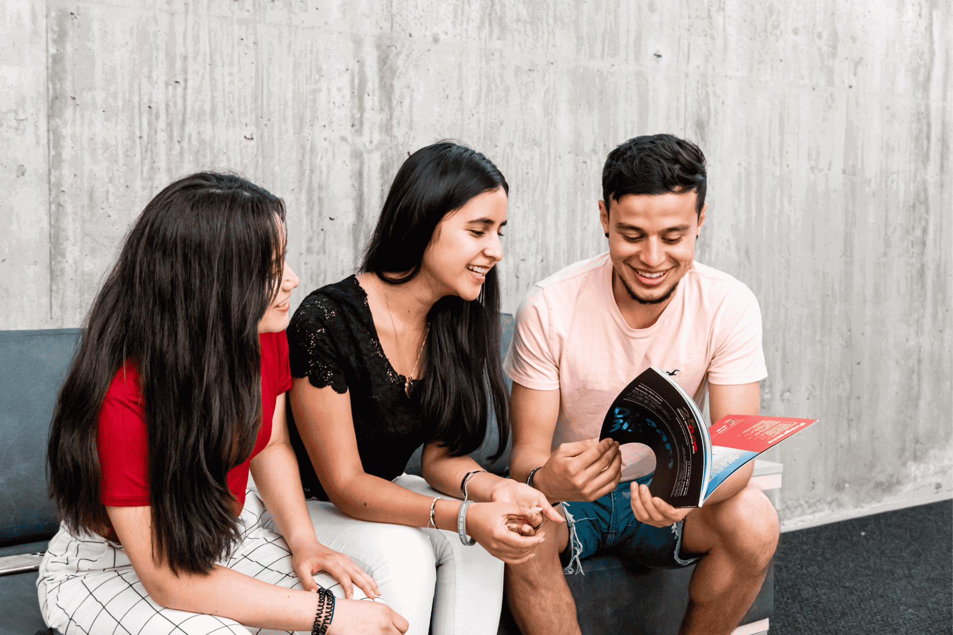 Three international students from International Language Academy of Canada sitting together and talking