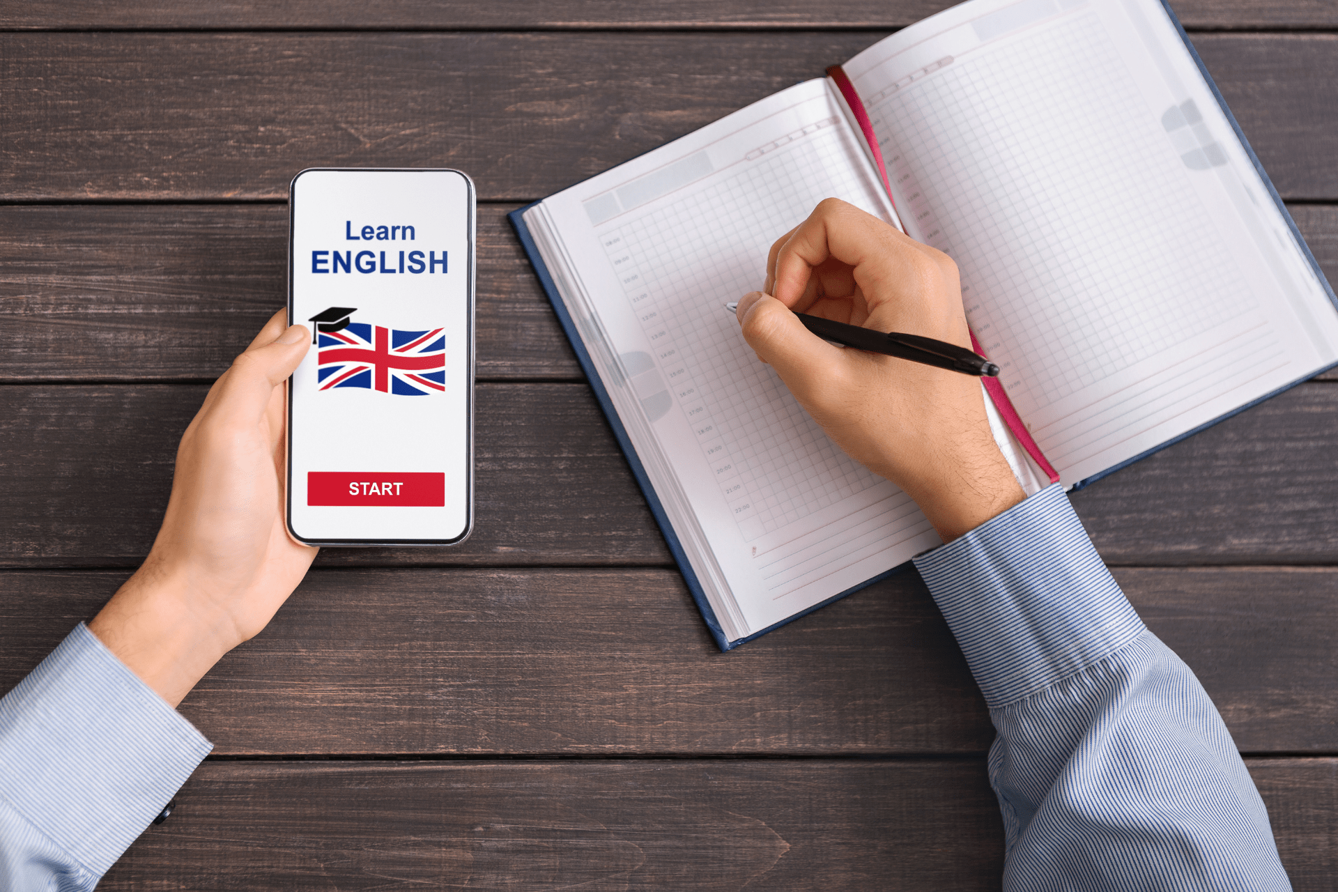 A person using a language learning app to learn English while taking notes