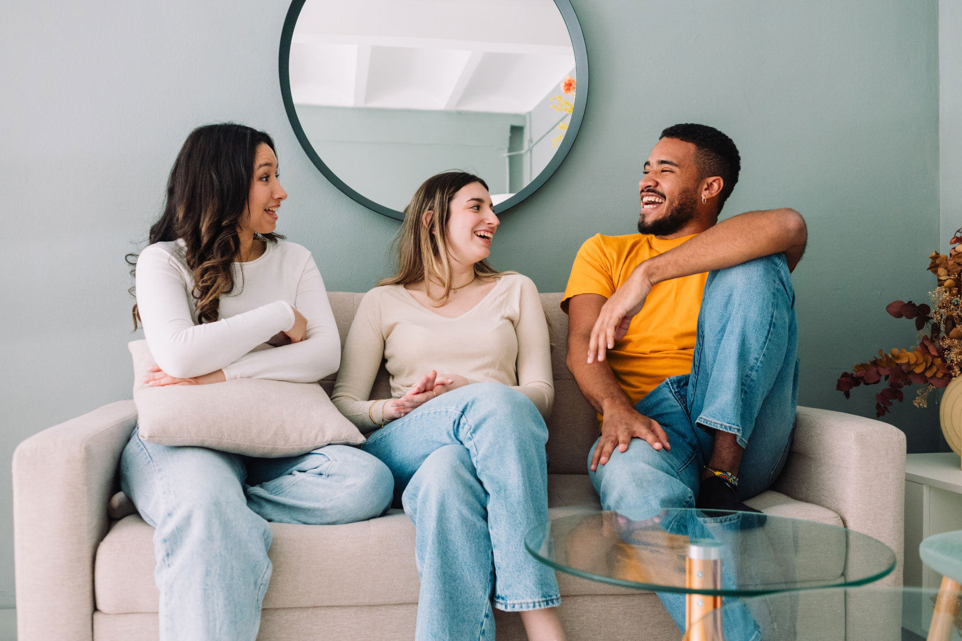Three friends relaxing on a couch