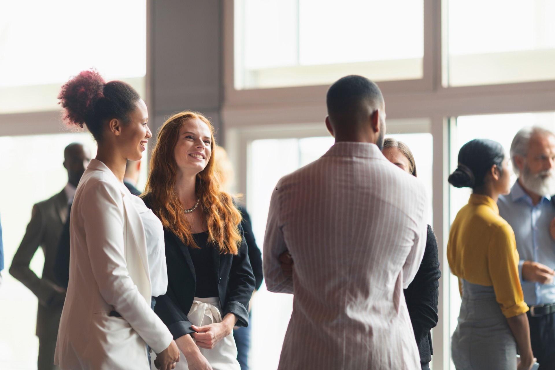 Business professionals interacting at a conference 